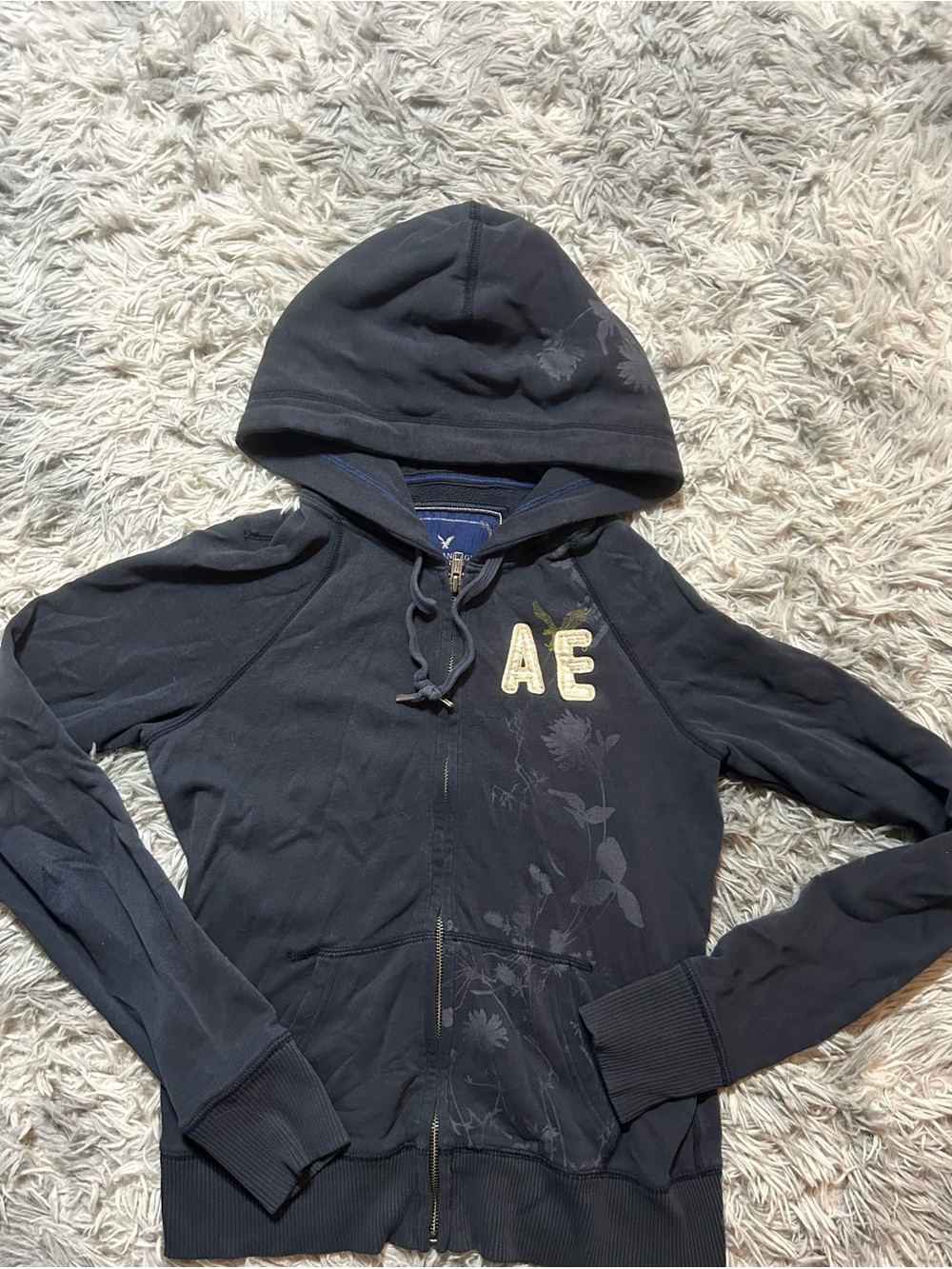 American Eagle Outfitters navy zip-up fleece hoodie with cream logo